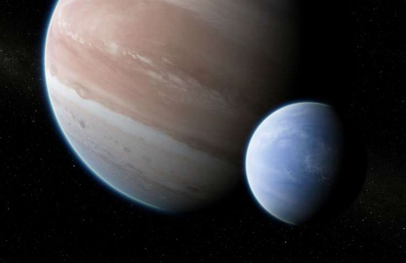 Artist's impression of the exoplanet Kepler-1625b, transiting the star, with the candidate exomoon in tow.