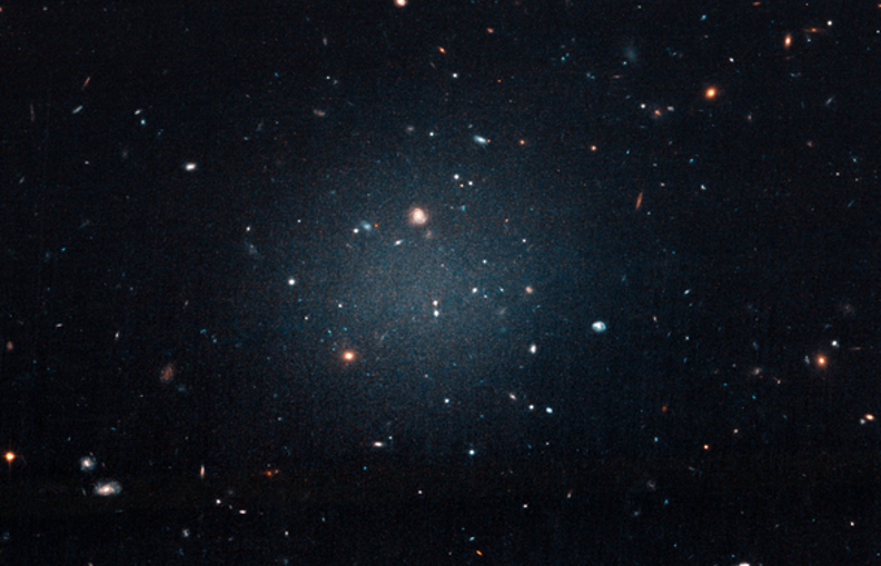 The bizarre galaxy NGC 1052-DF2, a diffuse collection of stars, gas and dust that is apparently devoid of dark matter.