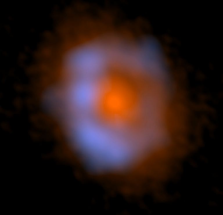 False-color image of V883 Ori taken with ALMA. The distribution of dust is shown in orange and the distribution of methanol, an organic molecule, is shown in blue.
