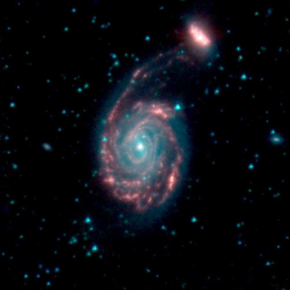 The merger of two galaxies, known as NGC 7752 (larger) and NGC 7753 (smaller), also collectively called Arp86