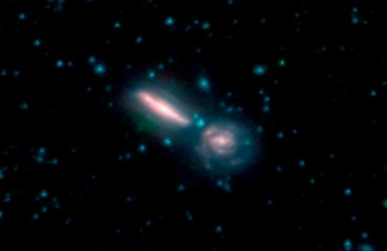 Two merging galaxies known as Arp 302, also called VV 340