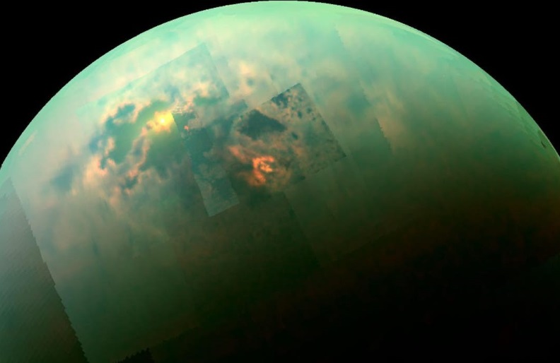A near-infrared, color mosaic from NASA's Cassini spacecraft shows the sun glinting off of Titan's north polar seas