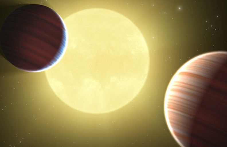 An artist's depiction of the stellar system Kepler-9 and two of its planets. Astronomers have confirmed the very low densities of two of Kepler-9's planets using both transit-timing and radial velocity methods. Credit: NASA, Jet Propulsion Laboratory/California Institute of Technology, Ames Research Center