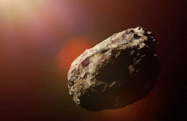 Artist's illustration of an asteroid in space.