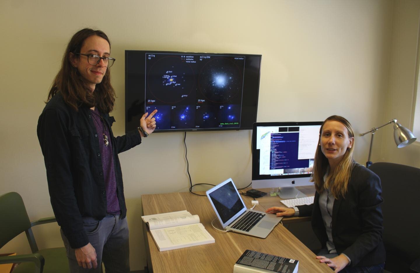 Laura Sales (right), an assistant professor of physics and astronomy at UC Riverside, is seen here with Ethan Jahn, her graduate student.