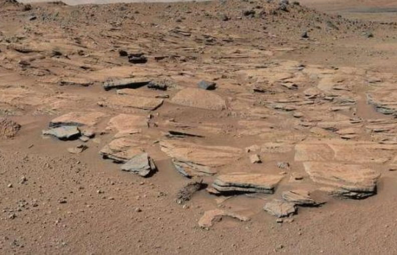 This NASA handout photo shows beds of sandstone inclined to the southwest toward Mount Sharp and away from the Gale Crater rim.