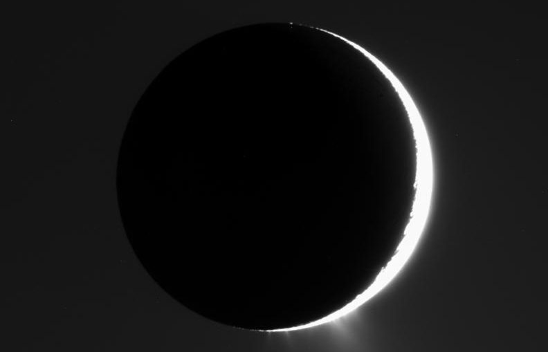 In this image captured by NASA’s Cassini spacecraft in 2007, the plumes of Enceladus are clearly visible. The moon is nearly in front of the Sun from Cassini’s viewpoint.